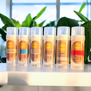 An array of Probiotic Deodorant sticks showcasing the different scent options: Natural, Lemongrass, Rose, Vanilla, Eucalyptus, and Sensitive with Magnesium.