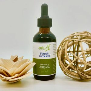 ABĒCA Naturals Fourth Trimester tincture bottle with wooden decorations.
