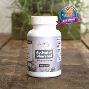 Earthley Activated Charcoal supplement bottle with Parents' Picks Awards 2026 Winner badge on wooden surface